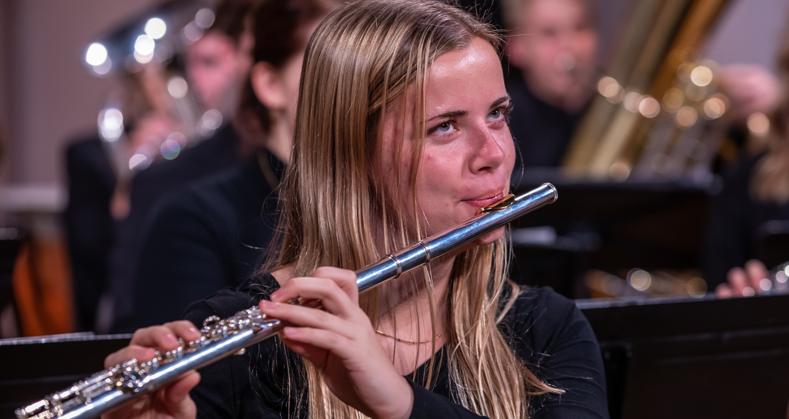 Student musician playing the flute