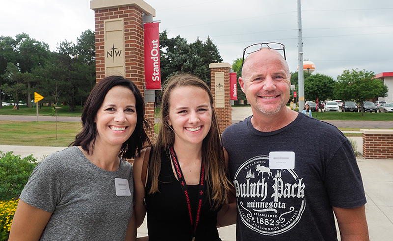 Northwestern freshman poses with her parents at new student orientation