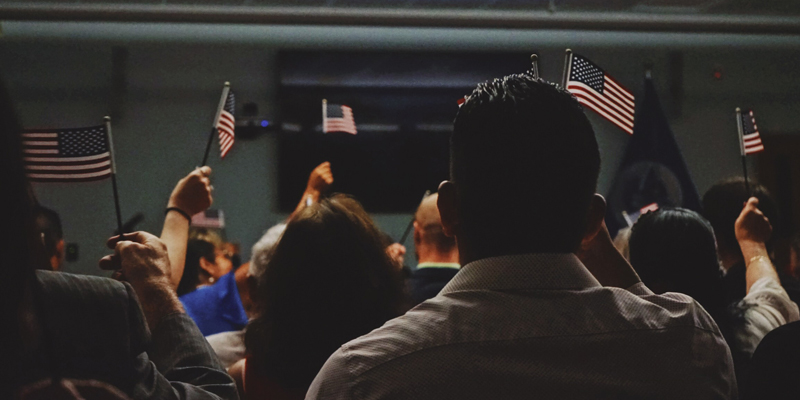 People holding United States flags