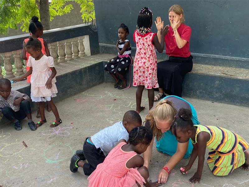 Northwestern students playing with children in Haiti