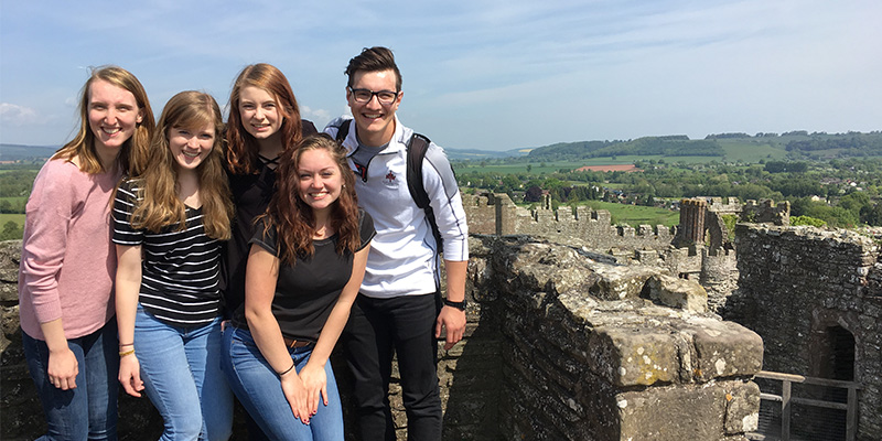 Northwestern College students visit a castle ruin in England