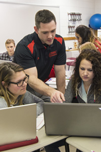 Korey Van Wyk teaching in classroom