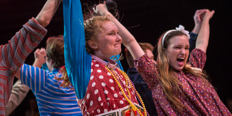 Students performing in theatre