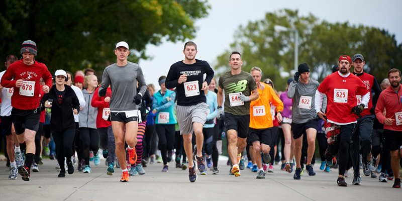 Participants running in the Red Raider Road Race