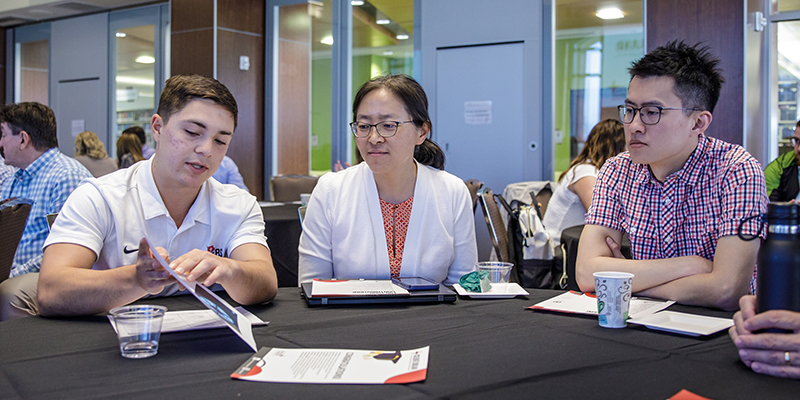 A graduate of Accelerate Siouxland's 2022-23 cohort explains the group's practical project to Northwestern professors