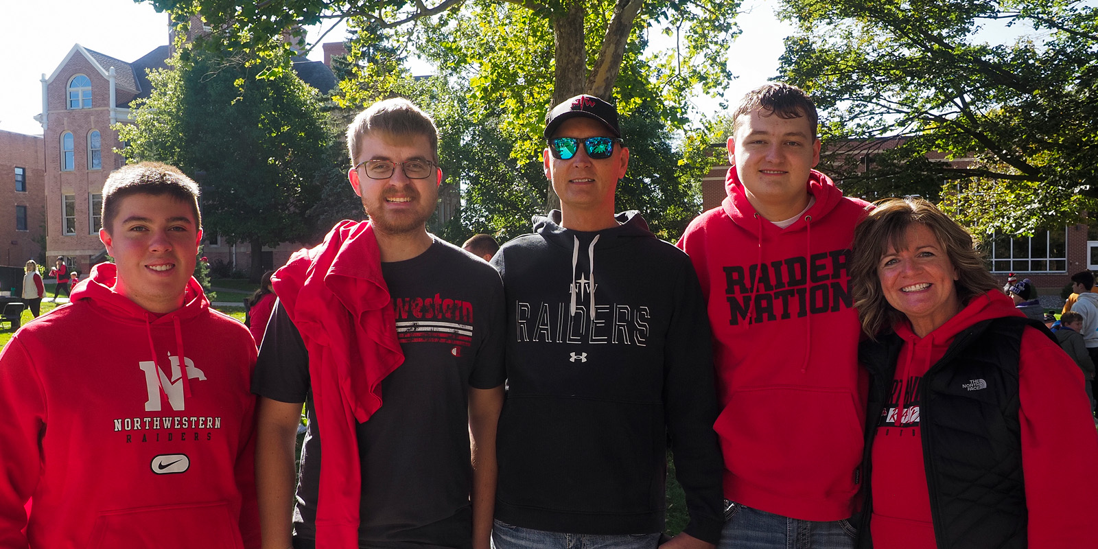 Family wearing Raider red at 2023 Homecoming