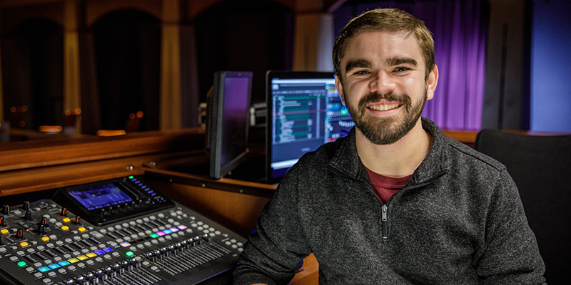 Wyatt Waage, theatre graduate, in the sound booth